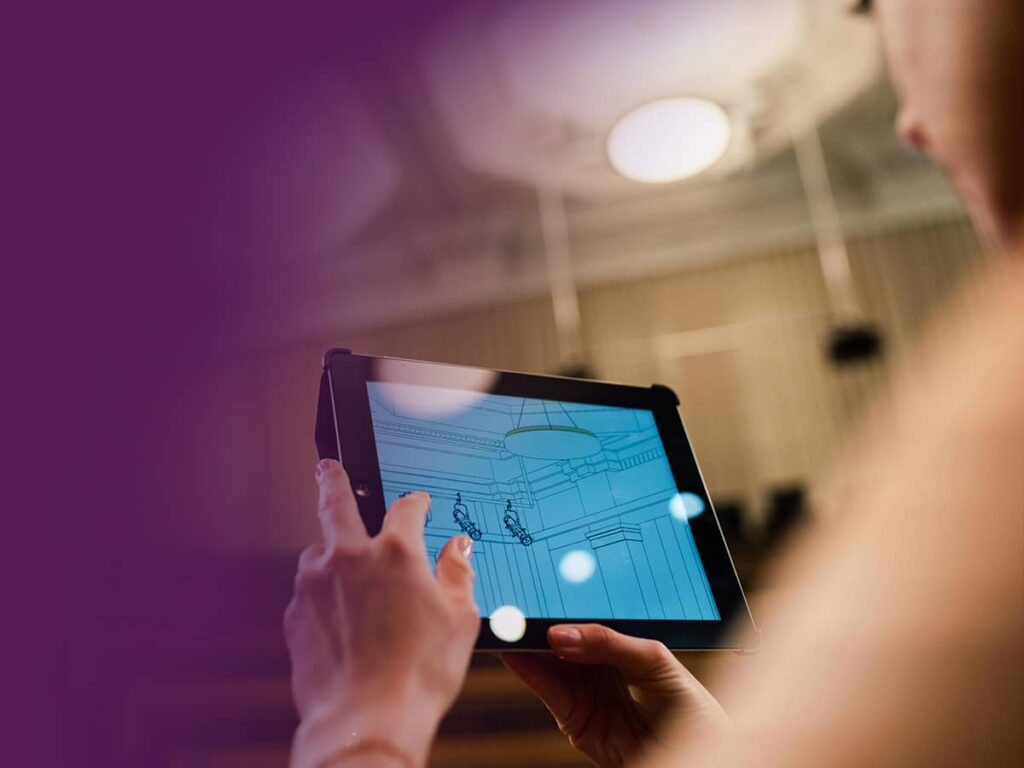 Woman looking at plans on a tablet