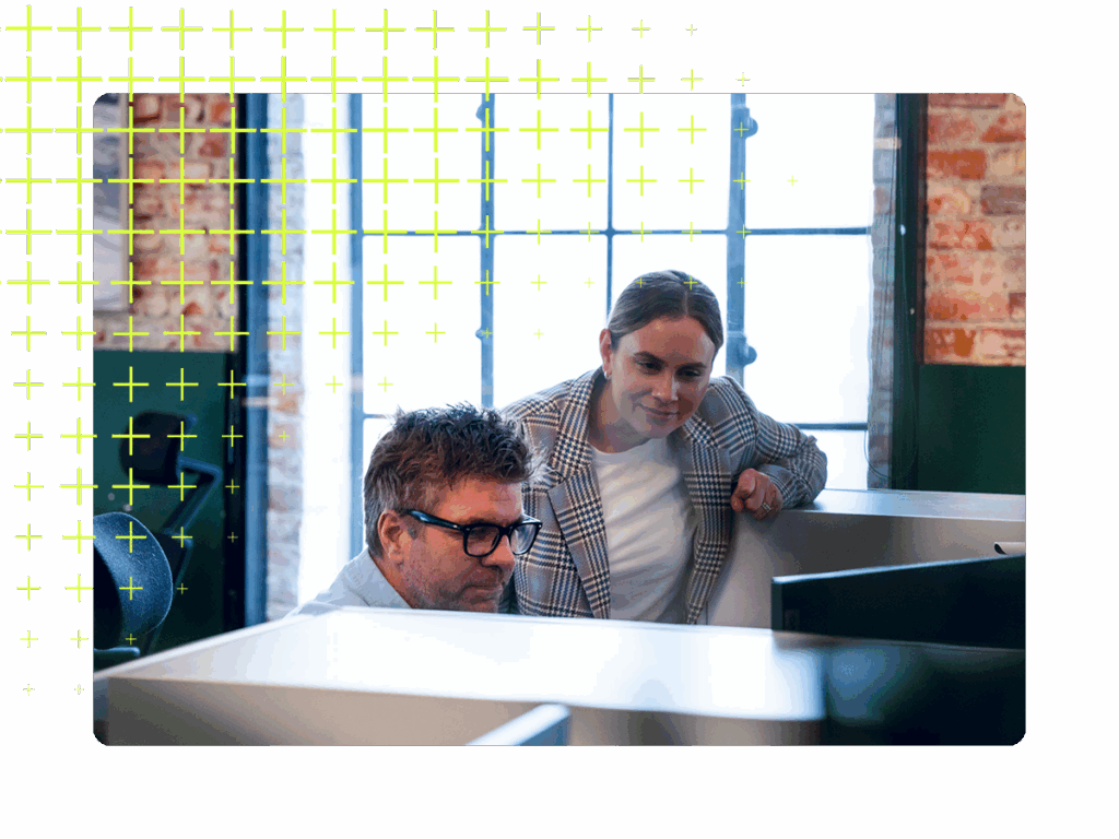 Two people looking at a screen