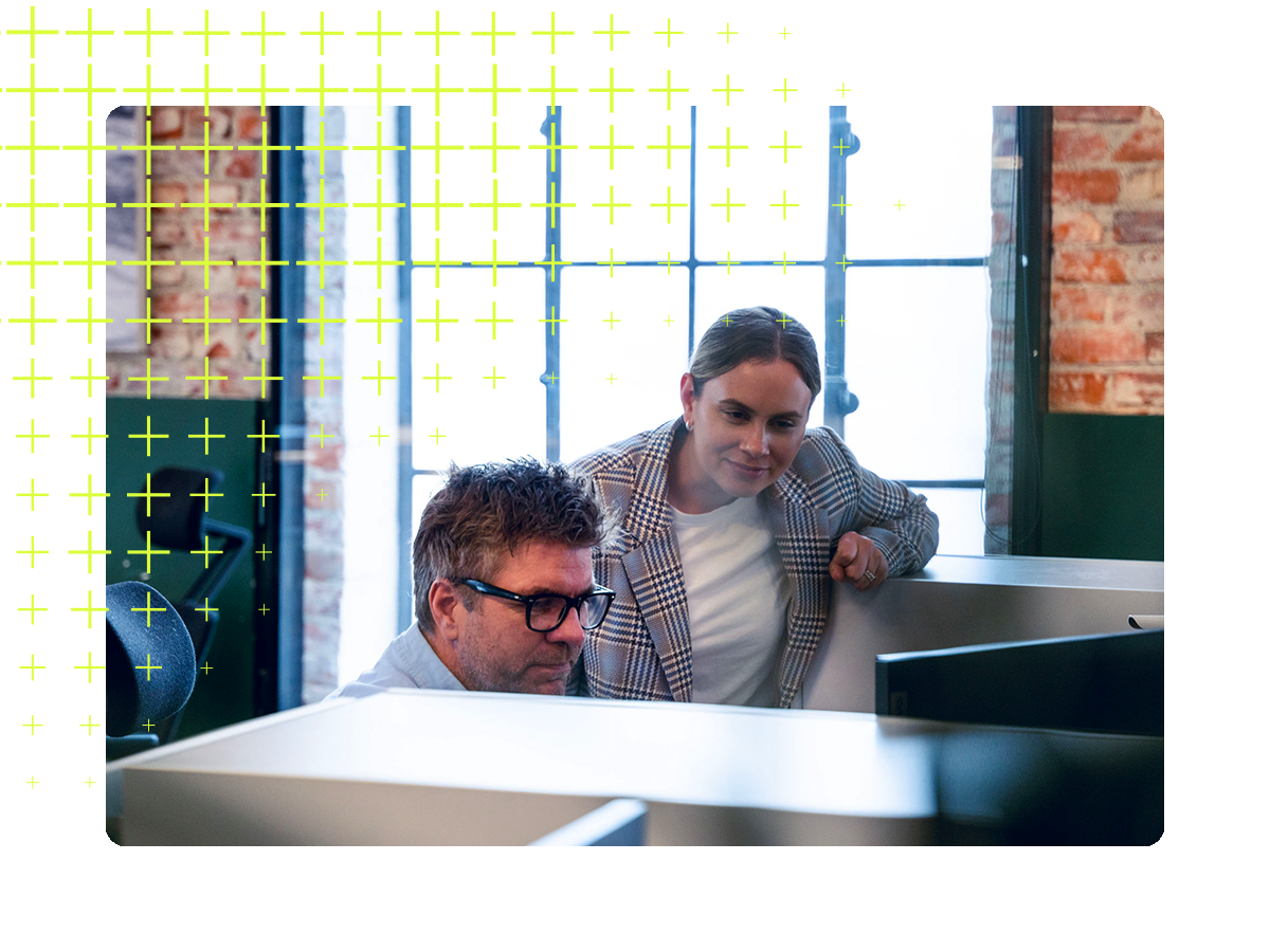 Two people looking at a screen