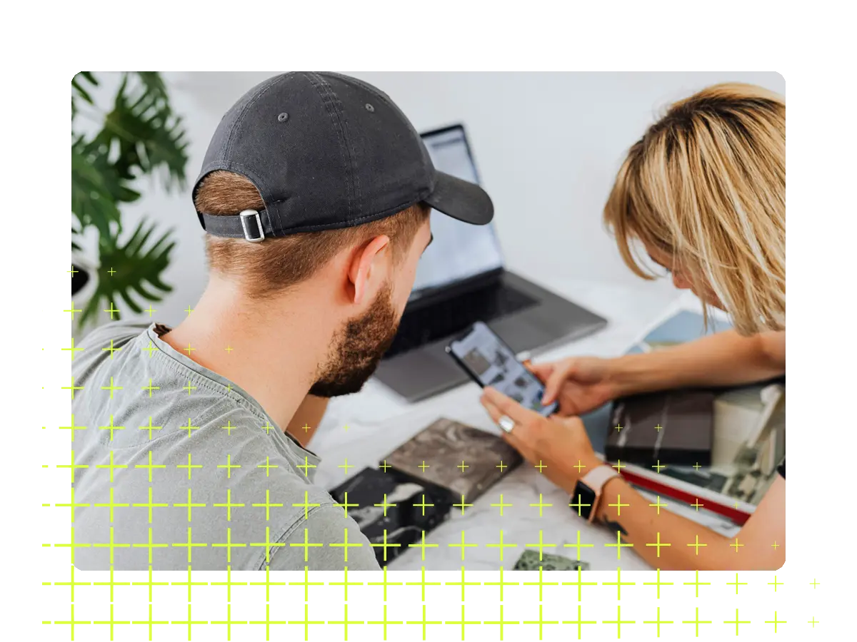 Two people looking at a phone